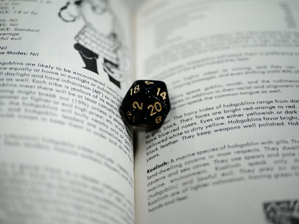 Dungeon & Dragon dice sitting on text